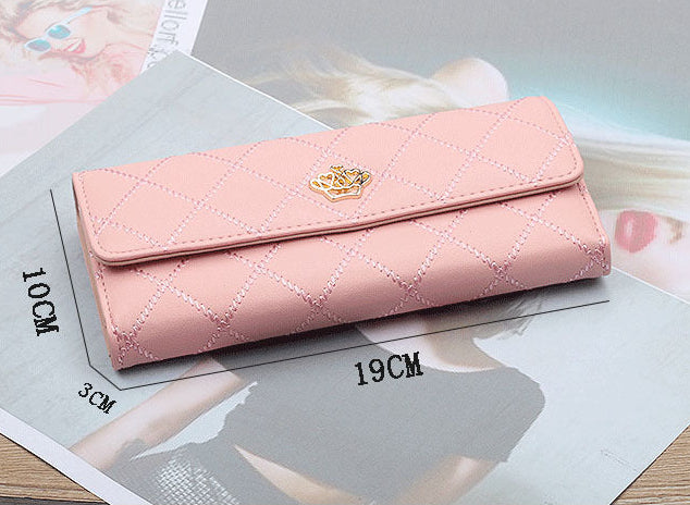 Pink quilted wallet on a measurement card with visible brand logo