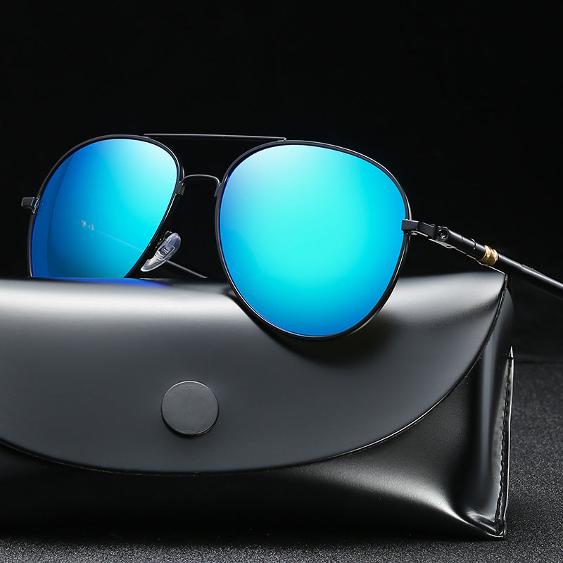 Blue reflective sunglasses on a black leather case against a black background