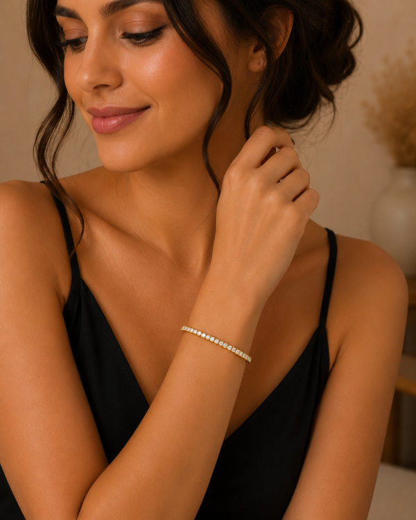 Woman wearing a bracelet, with a neutral background
