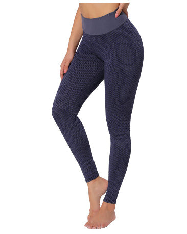 Navy blue patterned leggings worn by a person on a white background
