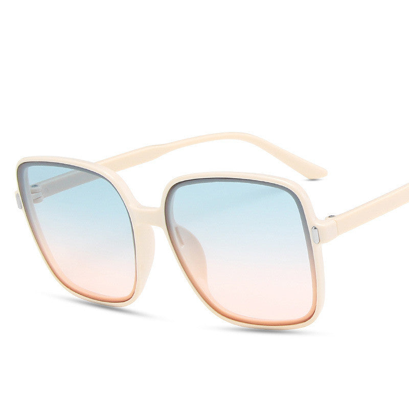 Sunglasses with gradient lenses on a white background
