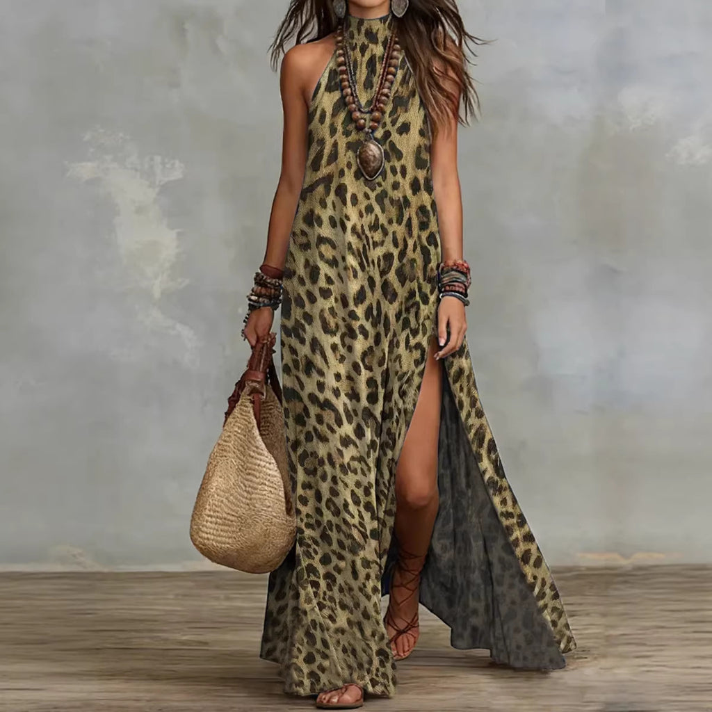 Woman wearing a leopard print dress with a gray overlay, holding a woven bag against a textured wall.