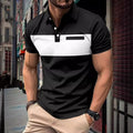 Man wearing a black and white striped polo shirt in an urban setting