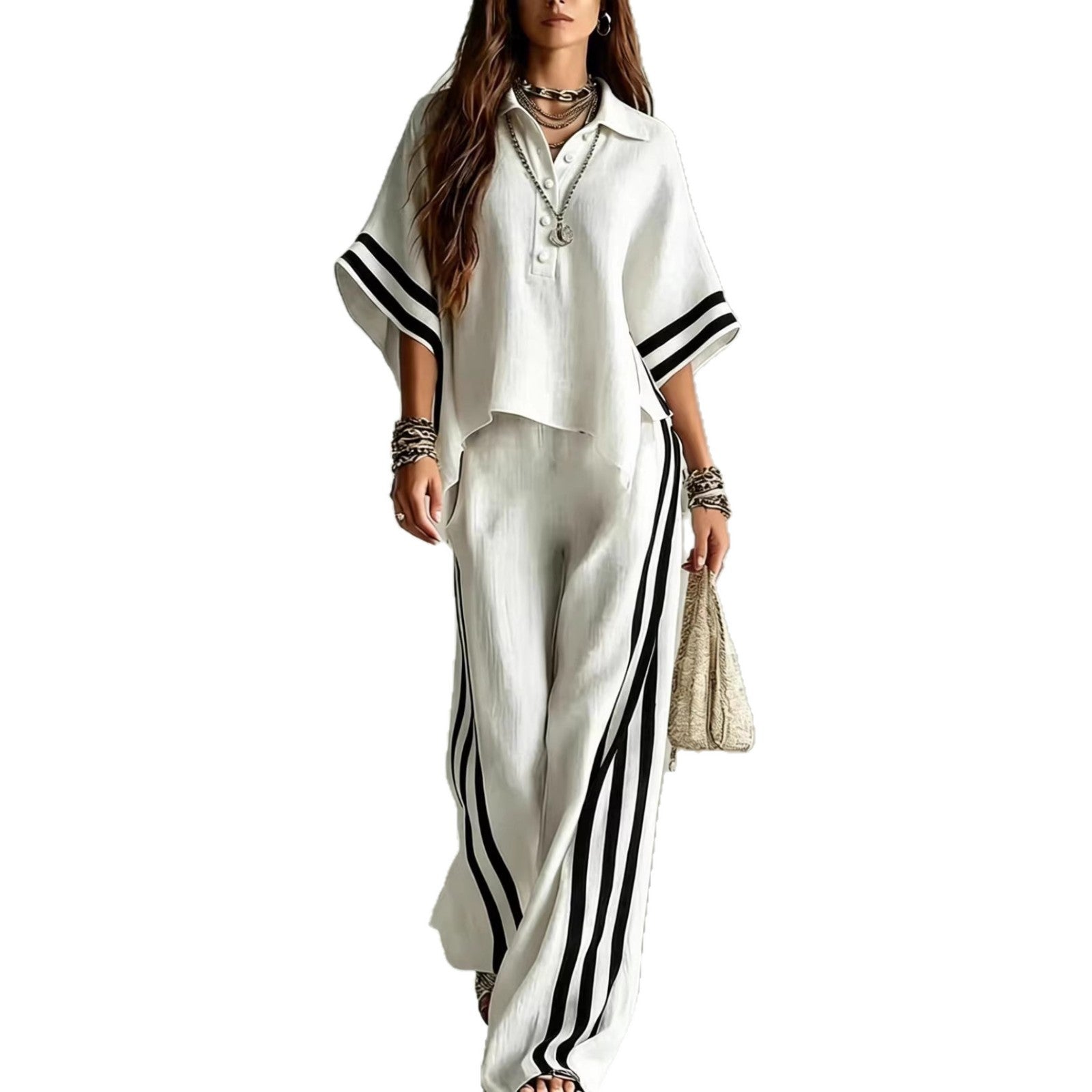 Woman wearing a white outfit with black stripes on a white background