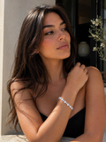 Woman wearing a black top with a blurred background