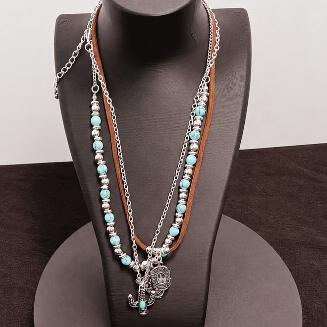 Necklace displayed on a black stand with a white background