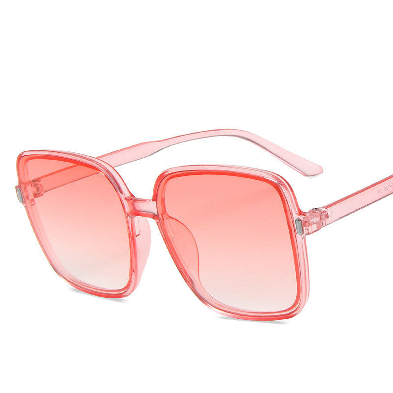 Pink sunglasses with a white background