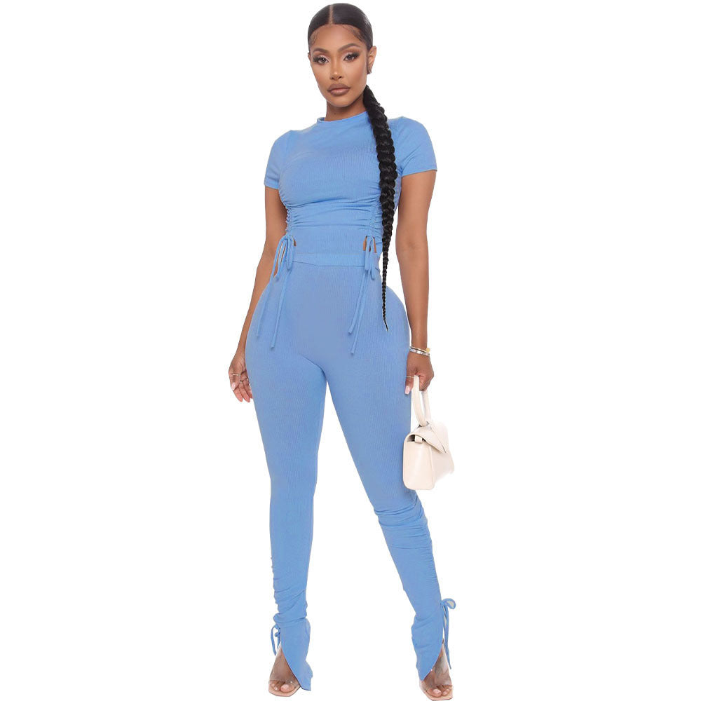 Woman wearing a blue jumpsuit on a white background