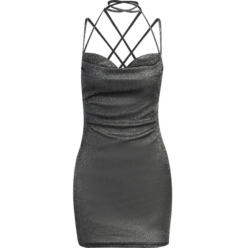 Black glittery dress with criss-cross straps on a white background