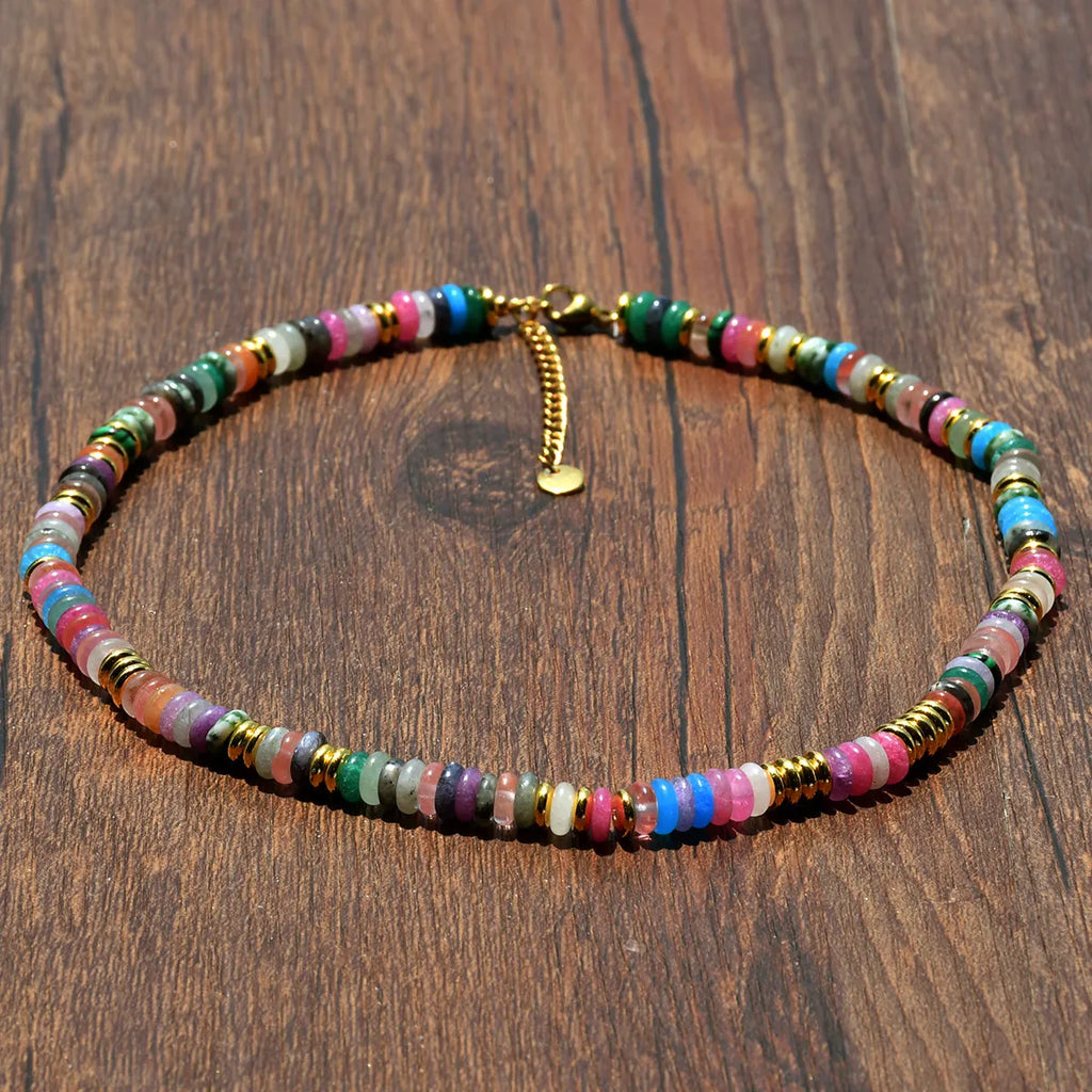 Multicolored beaded necklace on a wooden surface