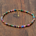 Multicolored beaded necklace on a wooden surface