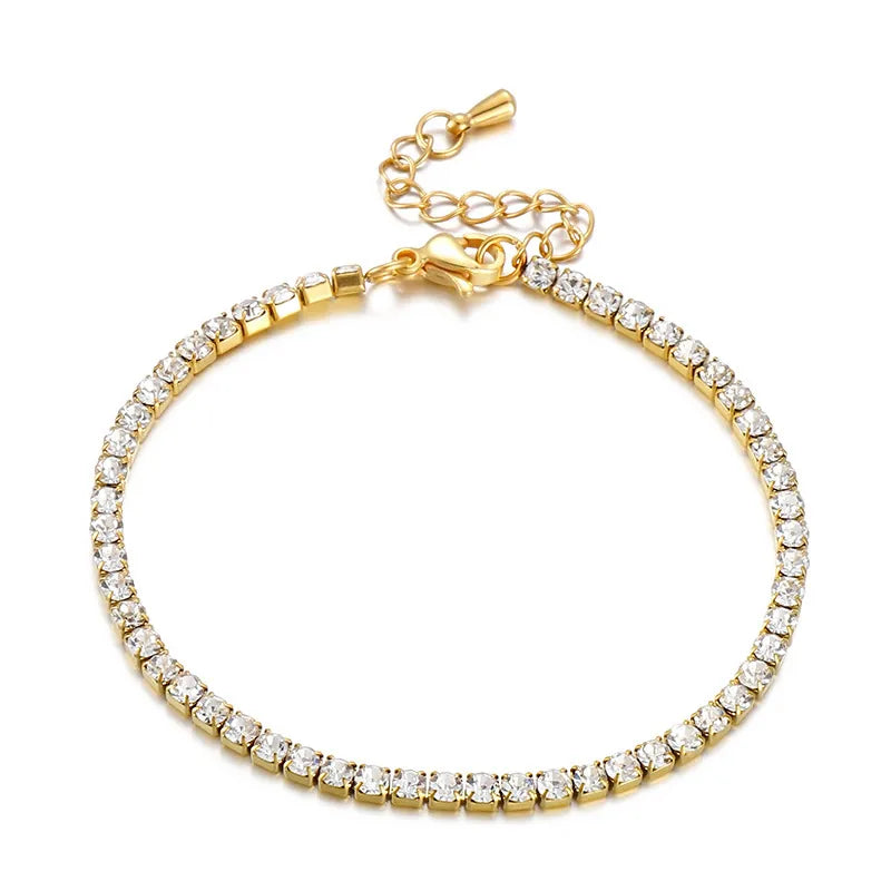 Gold bracelet with clear stones on a white background