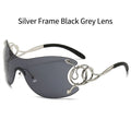Sunglasses with silver frame and black gray lenses on a white background