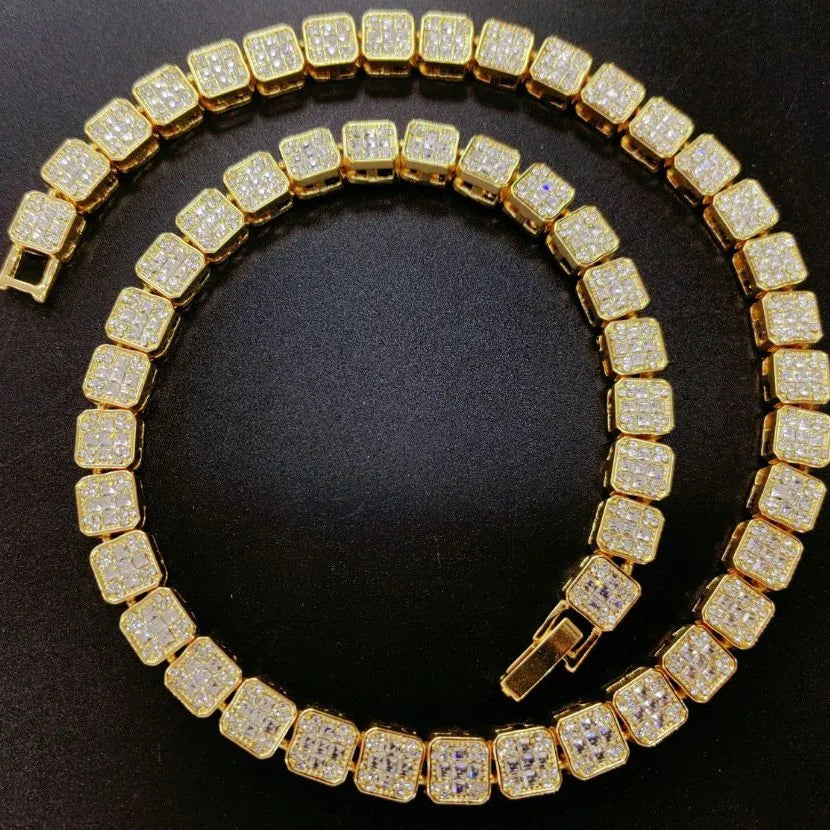 Gold chain with diamond-like stones on a black background