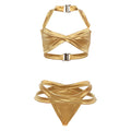Gold metallic top and bracelet set on a white background
