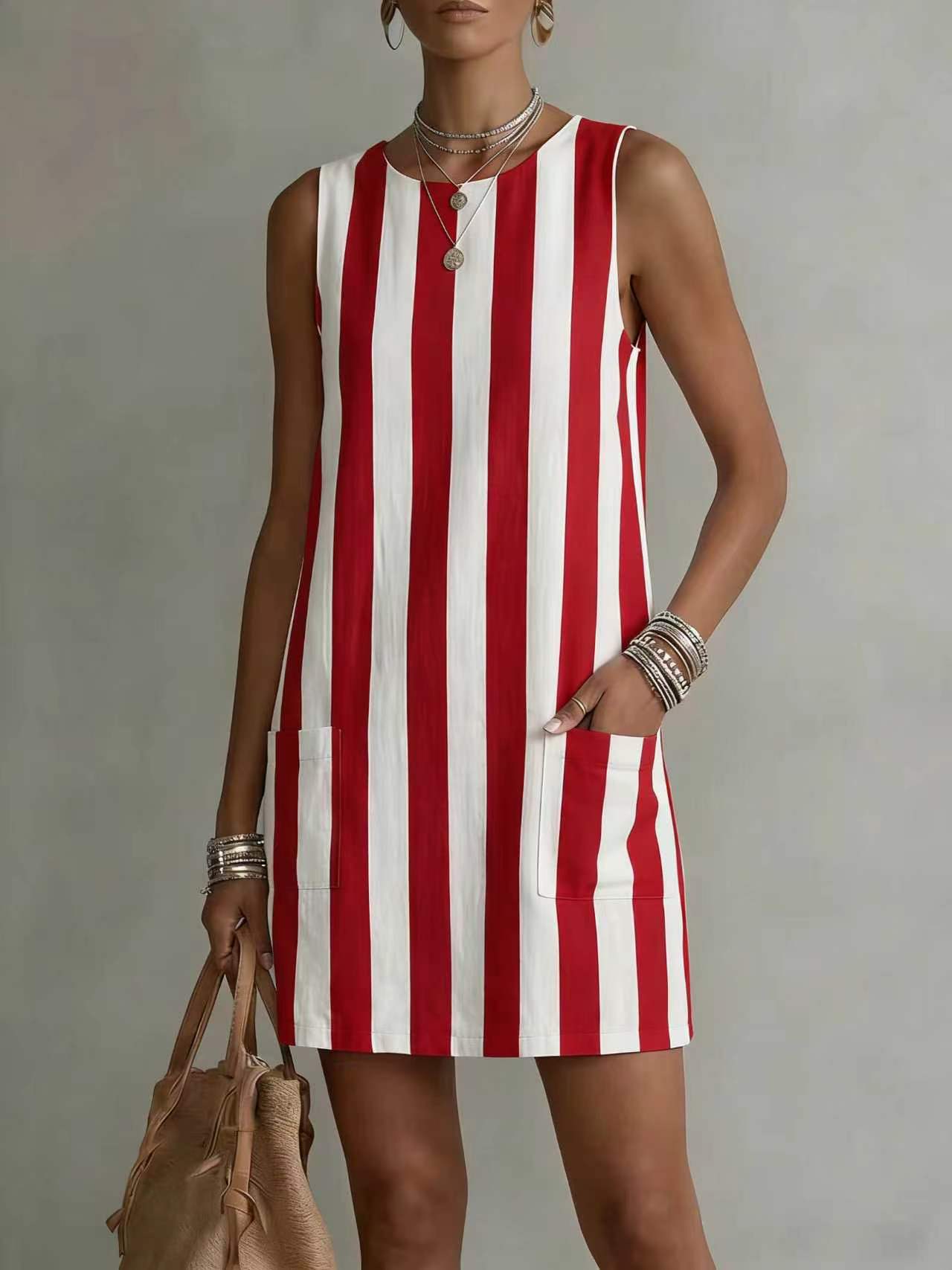 Woman wearing a red and white striped dress against a neutral background