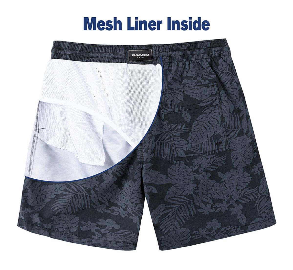 Black floral-patterned shorts with a white mesh liner inside on a white background.