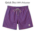 Pink and blue checkered shorts with a drawstring on a white background, labeled as quick dry 100% polyester.